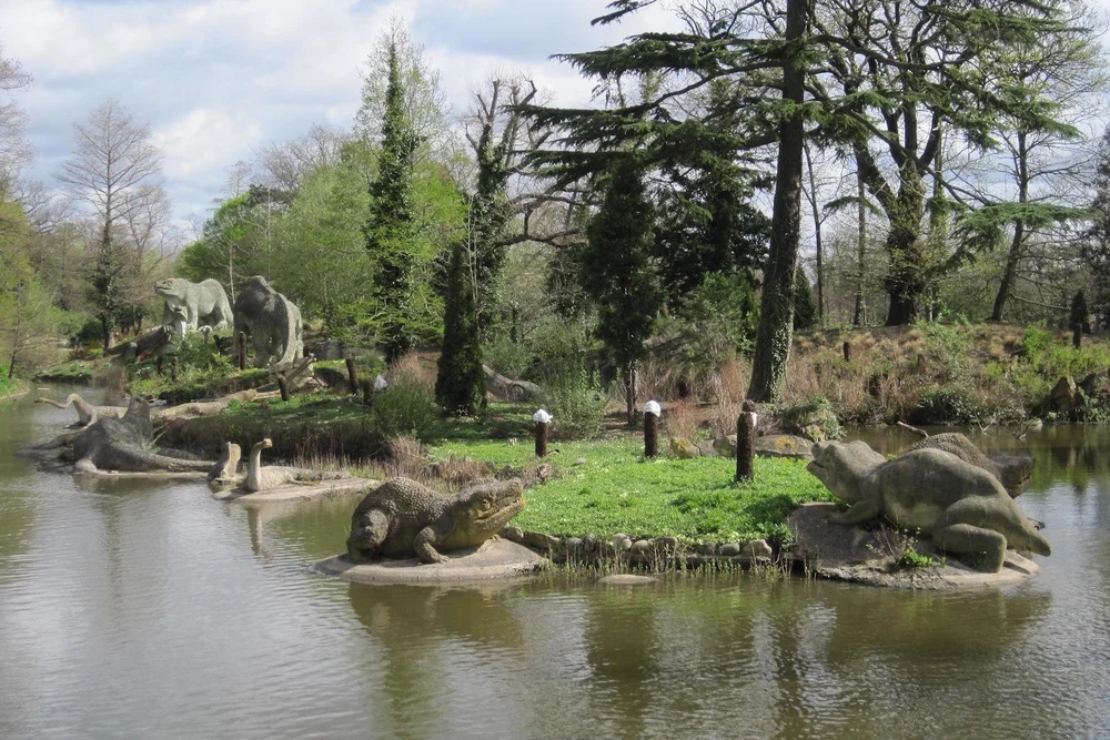  Some of the Crystal Palace dinosaurs - Victorian life-size sculptures (or replacements thereof) of dinosaurs, arranged on a tree-covered island in a small lake in Crystal Palace Park. 