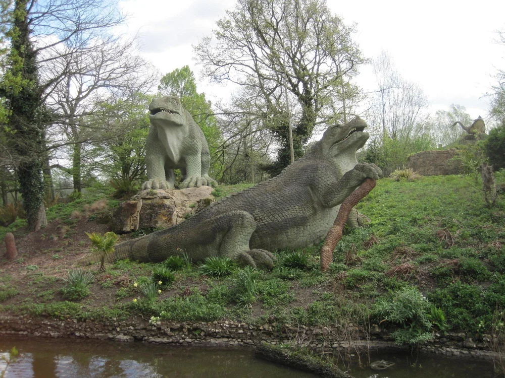  Two iguanodon sculptures, one posing with its front foot on a stick, the other has had a refurb so it is a much brighter green, and its toenails are dazzling white, like tooth veneers but for feet.  