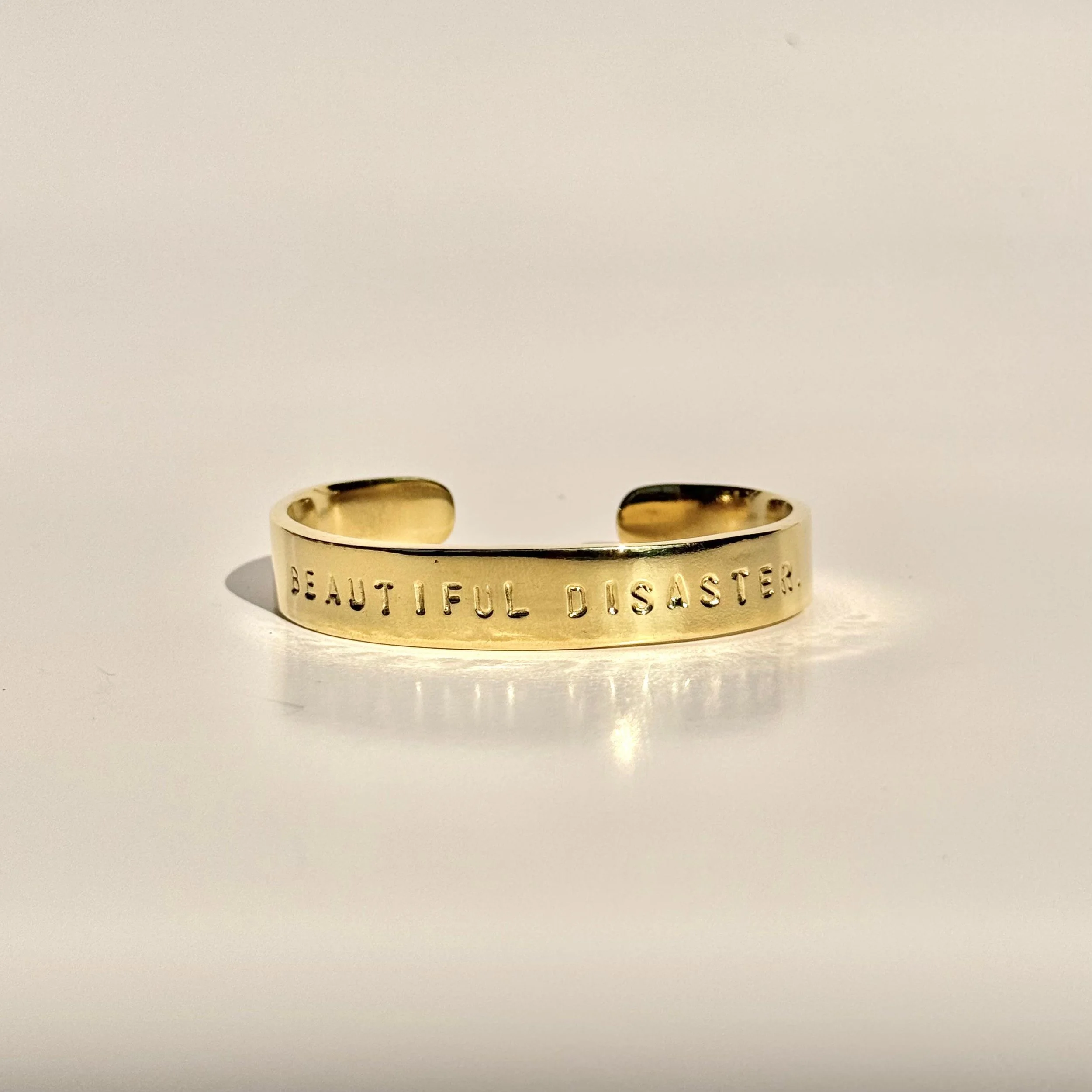 Beautiful Disaster Brass.jpeg