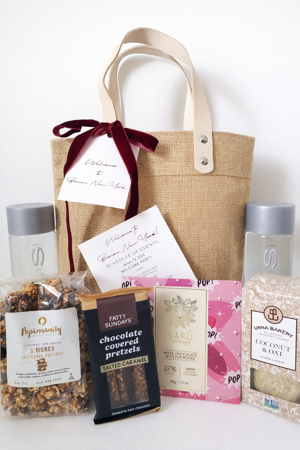 Custom wedding welcome gift bag designed for a Roundhouse wedding in Beacon, New York, featuring local New York treats and luxury packaging