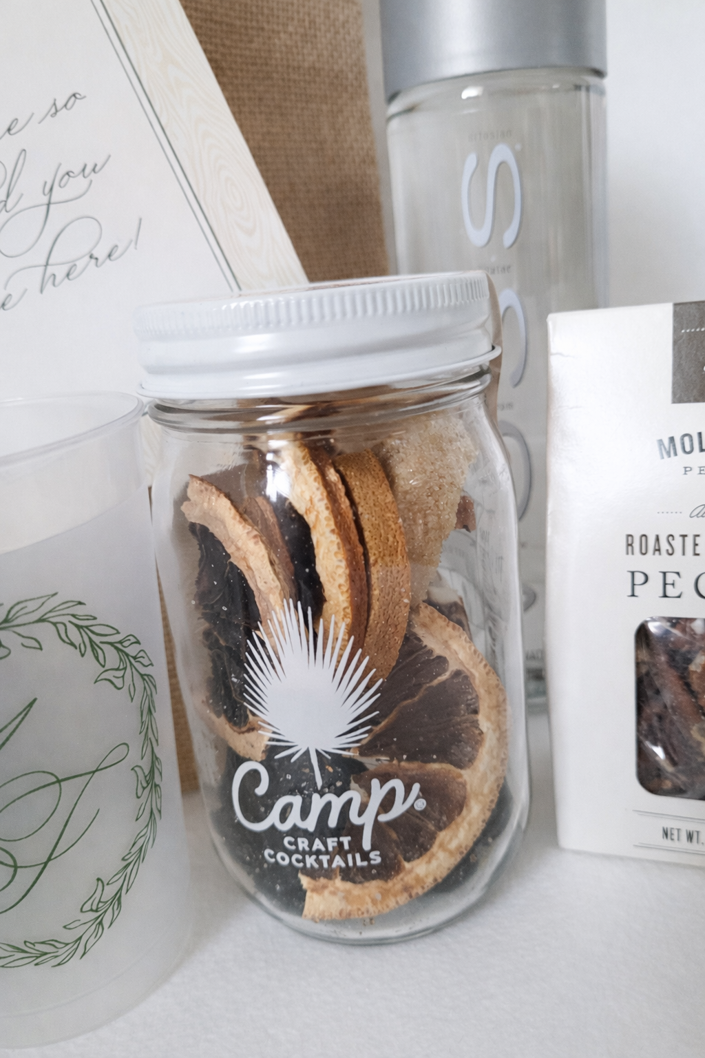 Fall wedding welcome gift at the Mayflower Inn featuring a Camp Craft Cocktails sangria jar included in a custom guest welcome bag