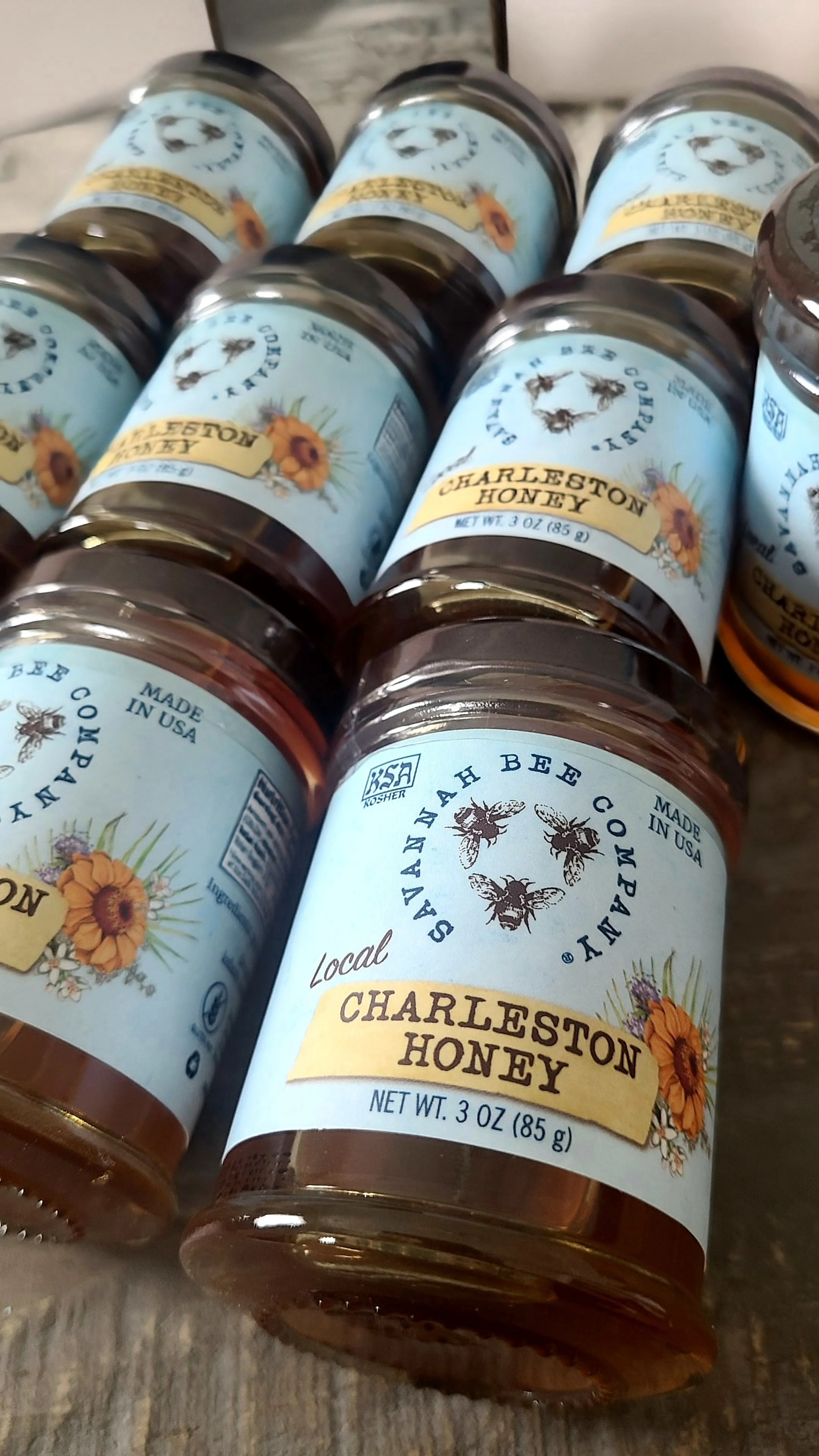 Jar of Savannah Bee Company Charleston-flavored honey included in a custom Kiawah Island SC corporate welcome gift box.