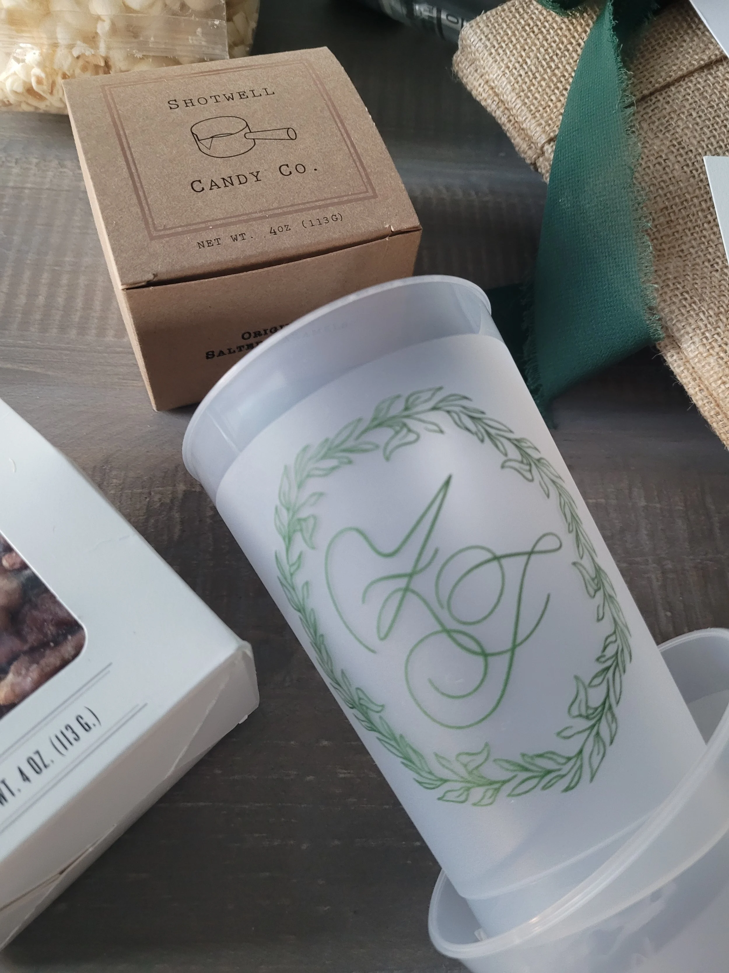 Luxury wedding welcome bag with monogrammed frosted cups at Mayflower Inn & Spa in Washington, Connecticut.