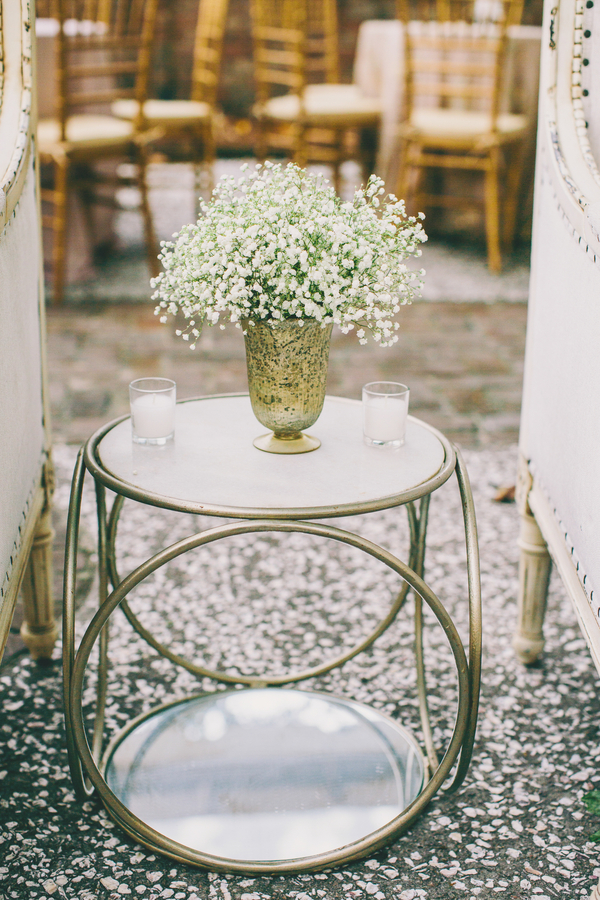 Gold End table with baby's breath centerpiece at William Aiken House wedding 