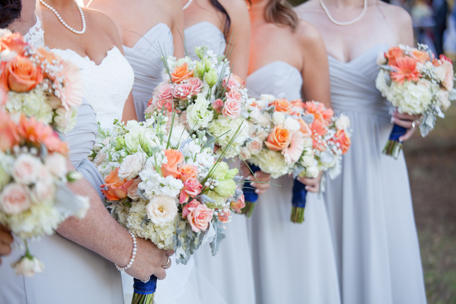 Light blue dresses and orange bouquets at Sunnyside Plantation wedding