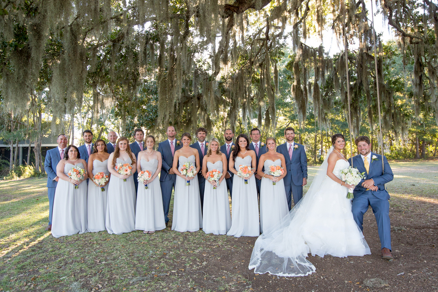 Light blue dresses and orange bouquets at Sunnyside Plantation wedding