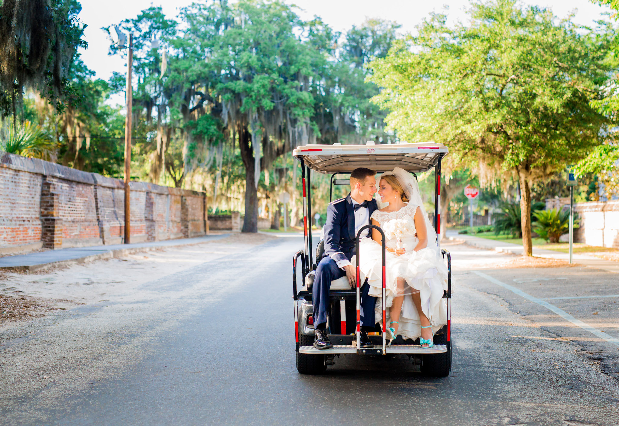 Bride & Groom's golf cart ride at Beaufort wedding 