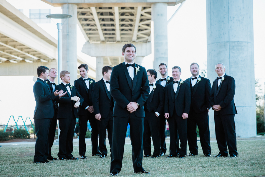 Charleston wedding groomsmen in black tuxedos at Cooper River Room by Judy Nunez Photography
