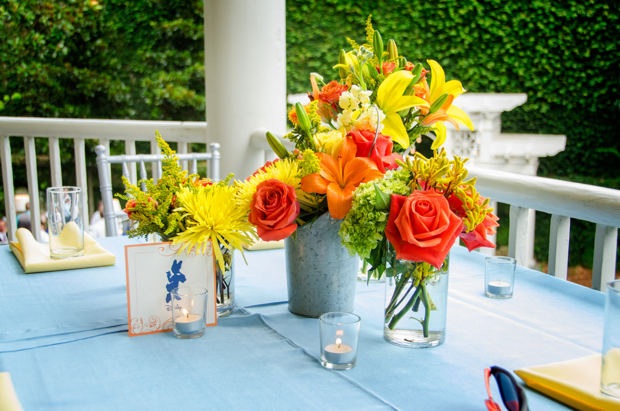 yellow and orange centerpieces at William Aiken House wedding in Charleston, Sc by inventivENVIRONMENTS