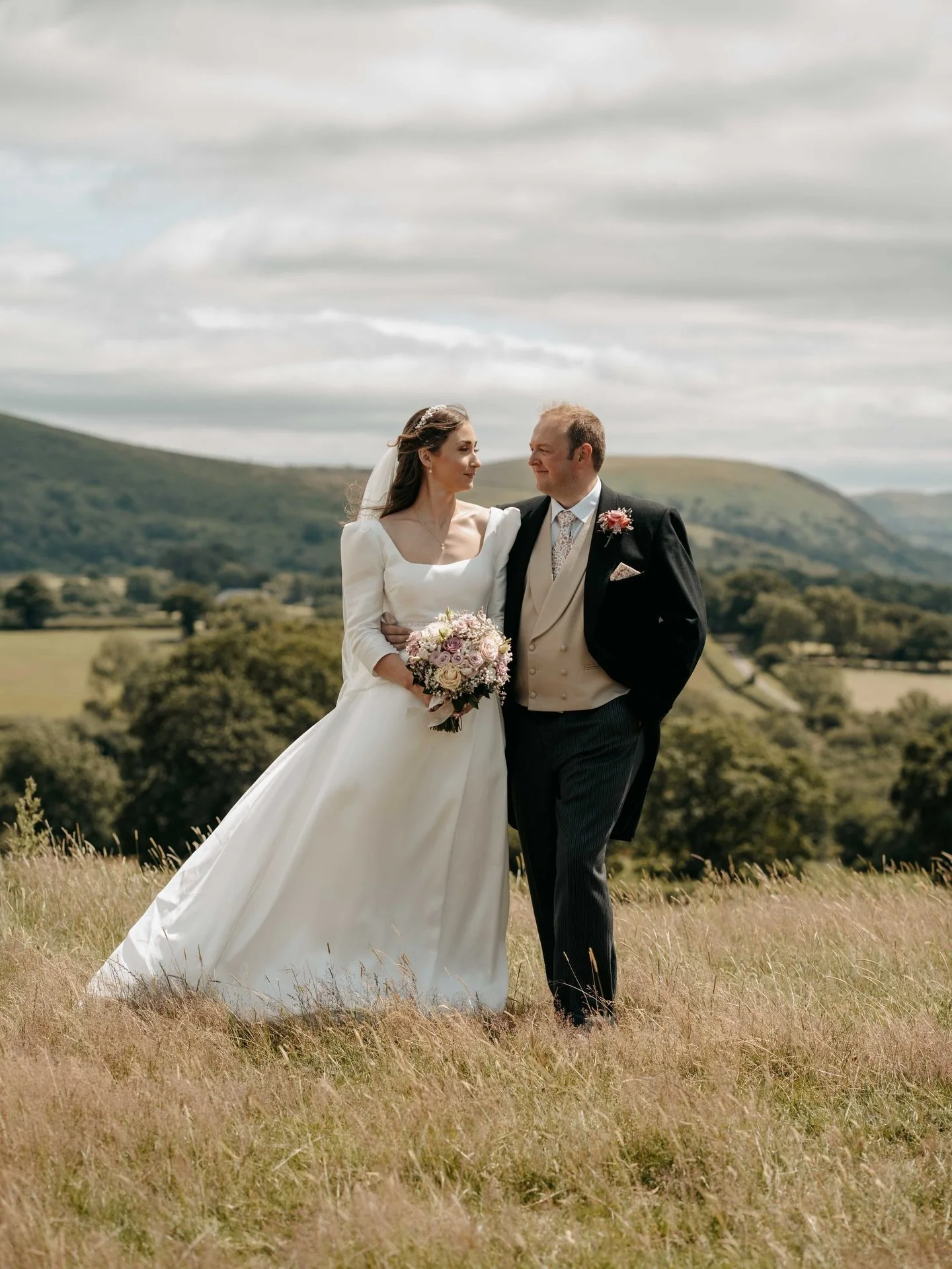 Alice &amp; Nick 

Dress: @bridalcric 
Suits: symonds
Hair: @corallewisbridal 
Makeup: @luciej_mua 
Flowers: @jaynesflowerstudio