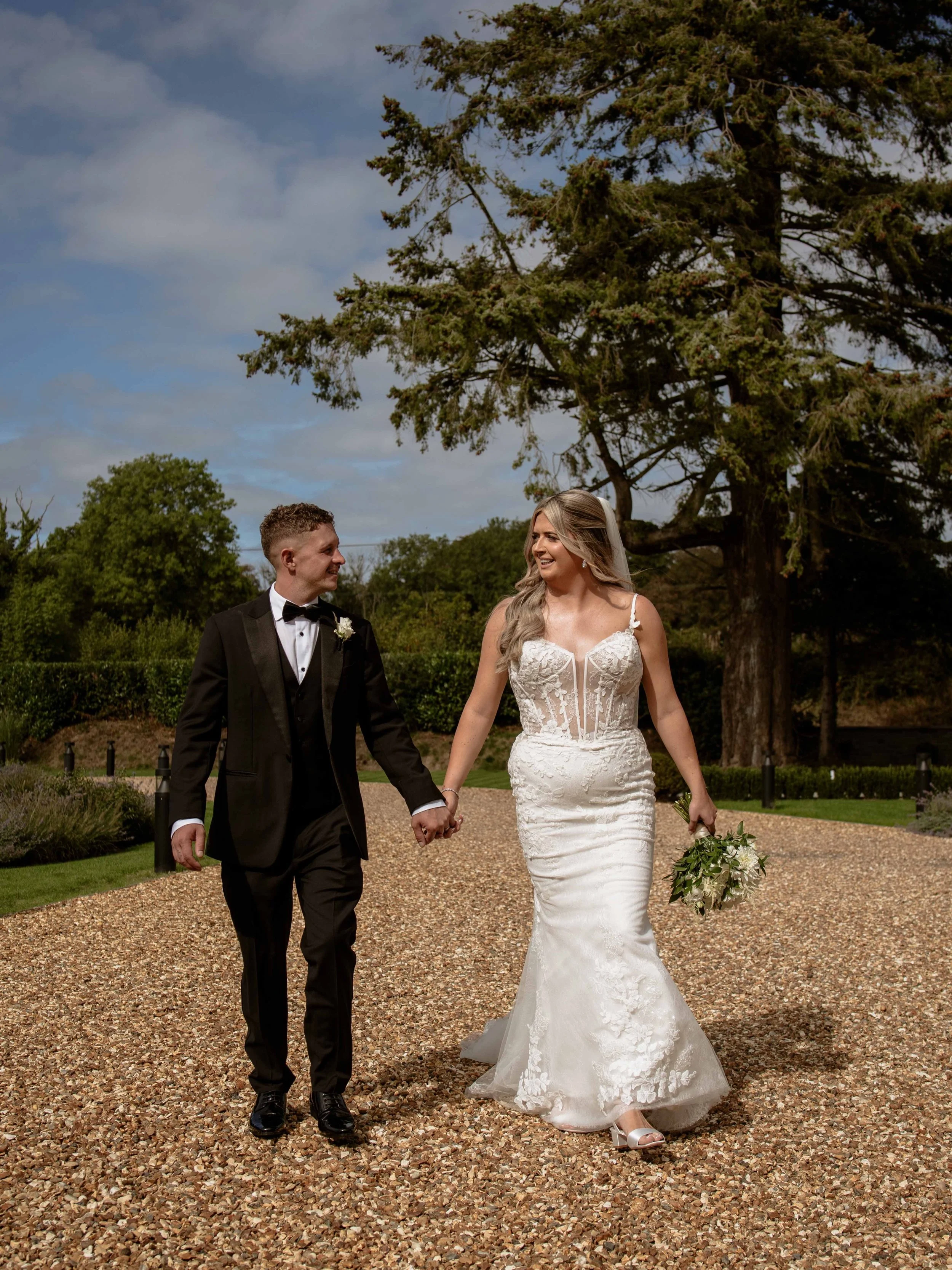 Menna &amp; Aled 

Hair - @hair_by_niaelen 
Make up - @yasminjmakeup &amp; @luciej_mua 
Suits - @mossbros 
Dress - @timelesselegancebridal 
Flowers - @expressionsflorists
Cake - aleds nan