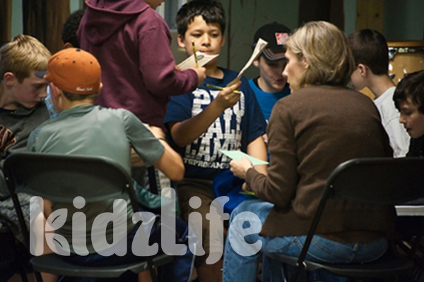 A group of KidzLife boys are very engaged in their small group activity. 