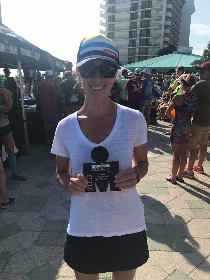 Jenn Stanton with an awesome race and some hardware to prove it.