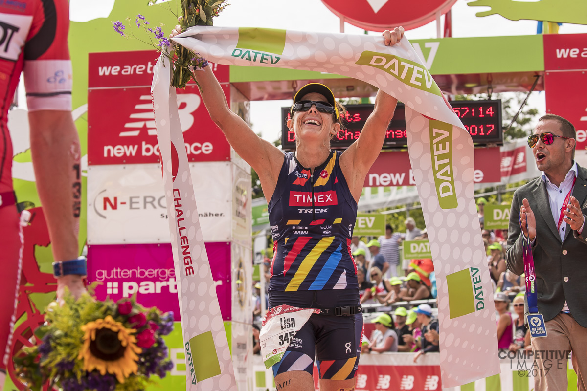 Lisa crossing the line in a blazing fast time of 8:57:14 - Photo: Competitive Image