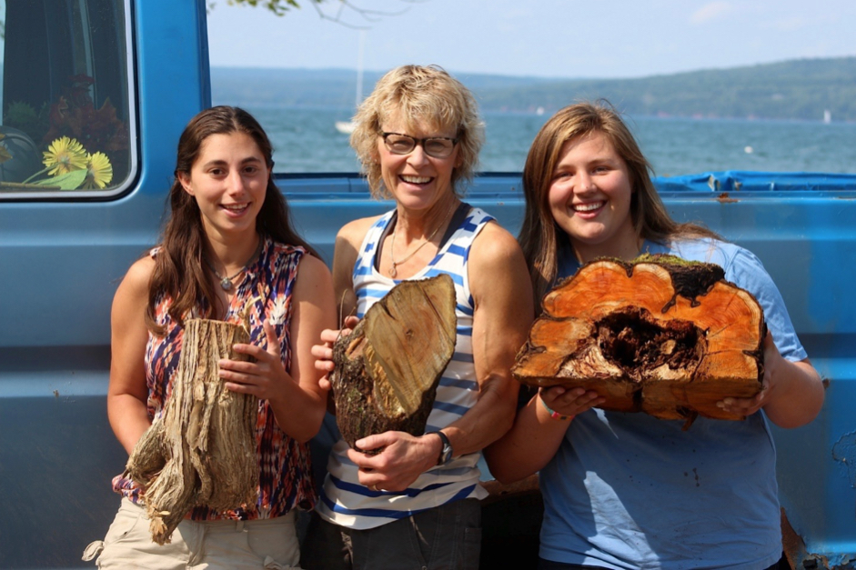 Pictured left to right: Brigid Reina holding largest honeysuckle stump (found on Chief Buffalo Ln), Bonnie Matuseski holding second largest buckthorn stump (found on Mission Hill), Rebecca Flesh holding half of largest buckthorn stump (found near Grant’s Point)