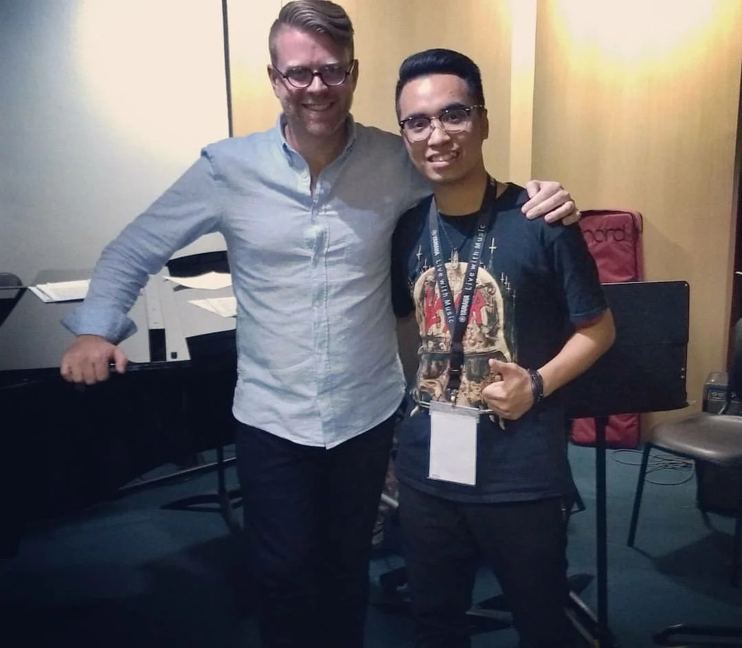 Myself and Tu, one of the students in my 13-piano Zebra Ensemble