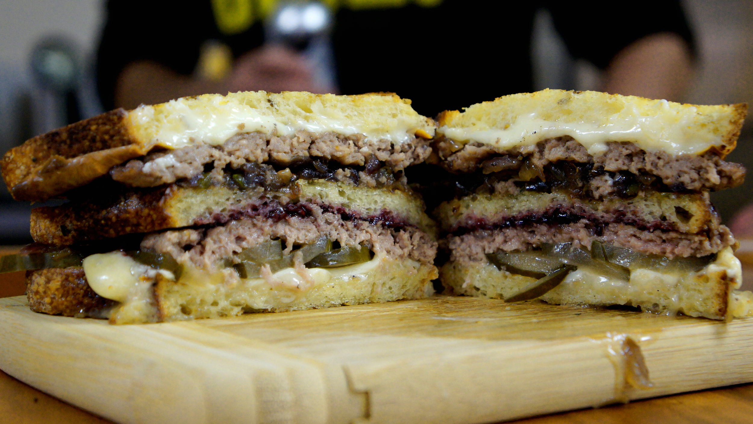 Amelia's semolina, Fischer Farms beef patty, house pickle made with Black Acre Saucy Intruder Rye IPA, Taleggio cheese, white American cheese, cipollini onion, jalapeno and Love Handle's berry jam.