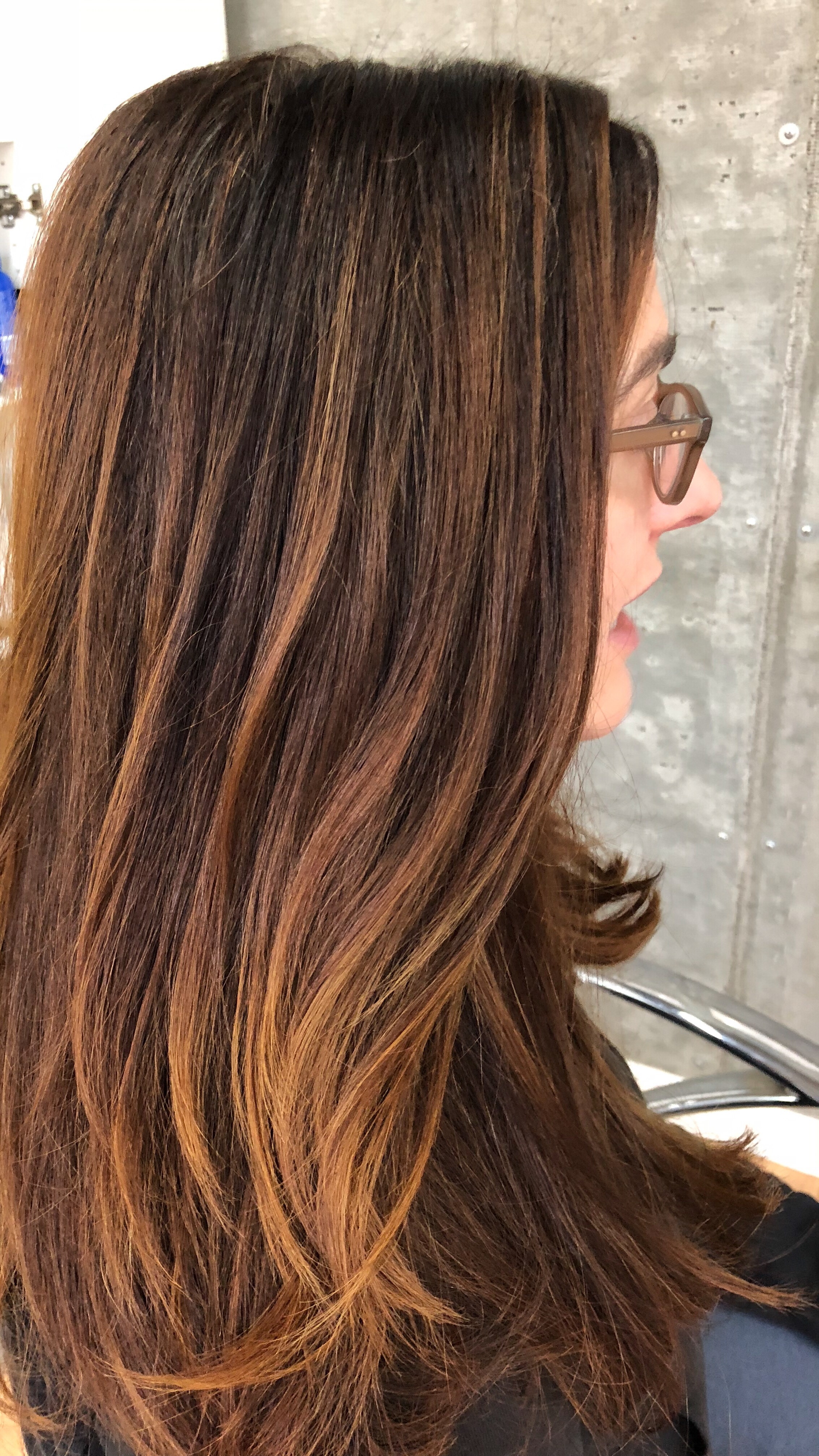  goal: rich chocolate base with medium warm lights  technique: gray coverage and balayage 