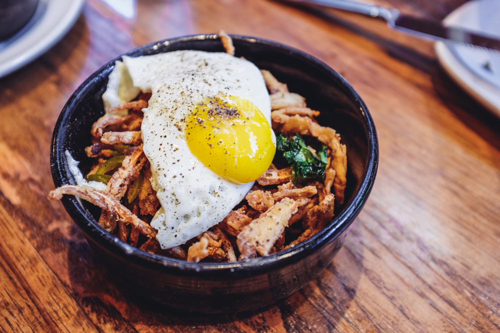 Pig's Ear with Crispy Kale, Pickled Cherry Peppers & Fried Egg @ The Purple Pig