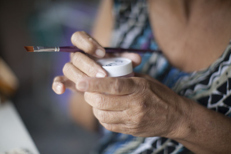 She used to love to go out and be active, but now she feels very limited in her home. She passes the time doing crafts.