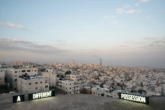 A DIFFERENT POSSESSION, Three on-location custom made light boxes, Looking onto Palestinian Village Issawiyah, annexed by Israel in 1967, from Mount Scopus, Jerusalem, 2014, Digital C print, 27X40 / 40X60 inches, Shimon Attie, courtesy of Jack Shainman Gallery, NY