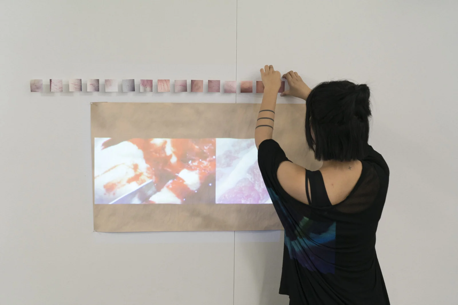 Returning student Di Wu setting up her mixed media works. 