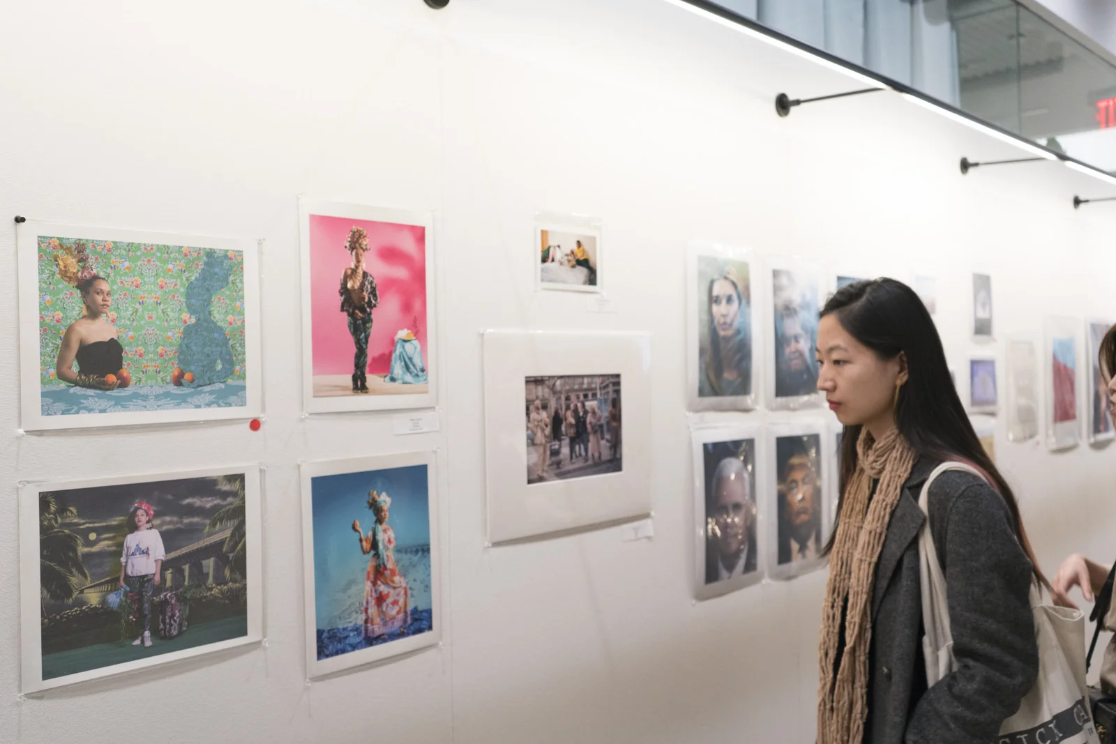 Guests glancing over the work in the print sale. 