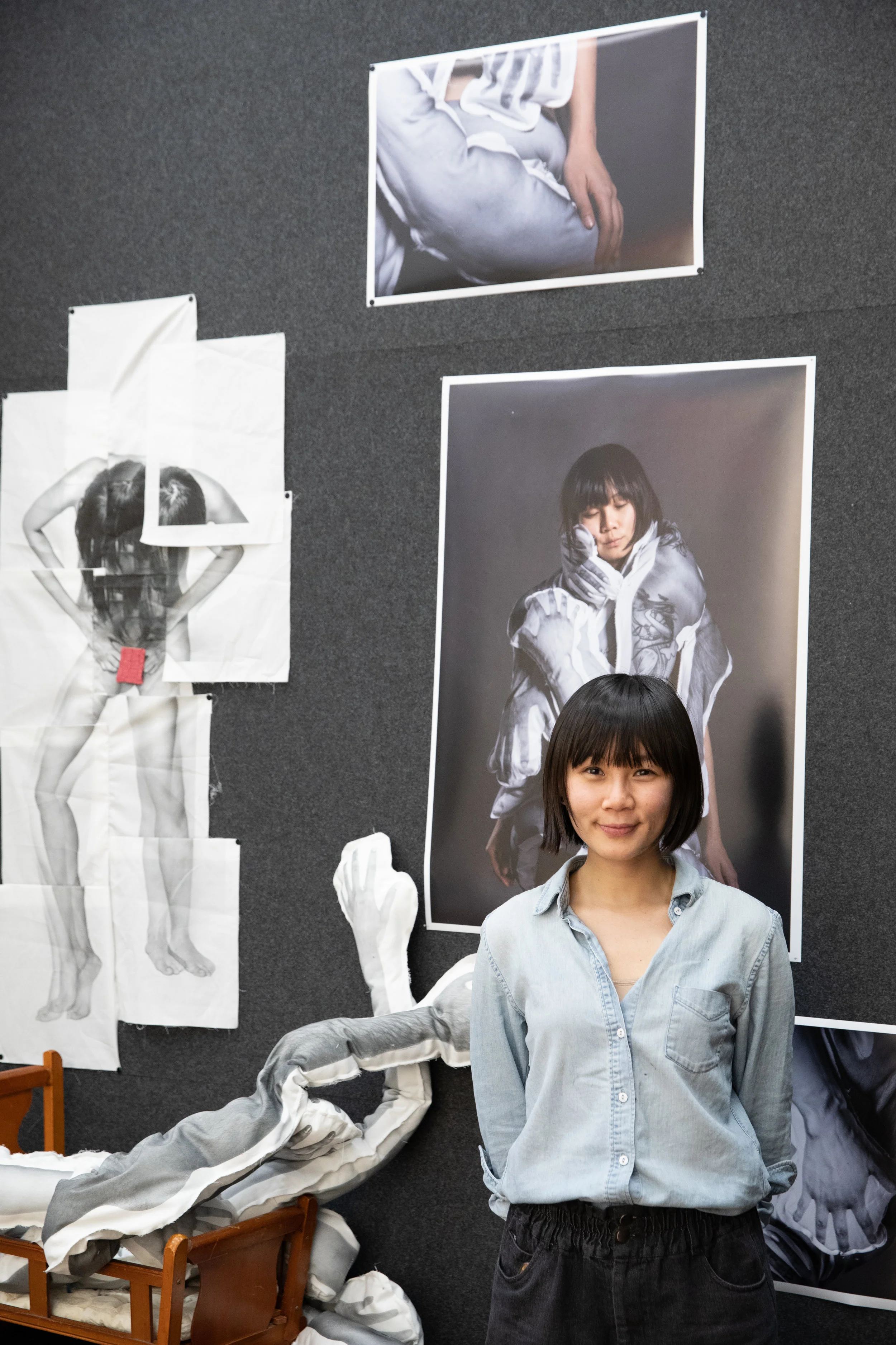 Yi Hsuan Lai (class of 2020) in front of a collection of her current works. 