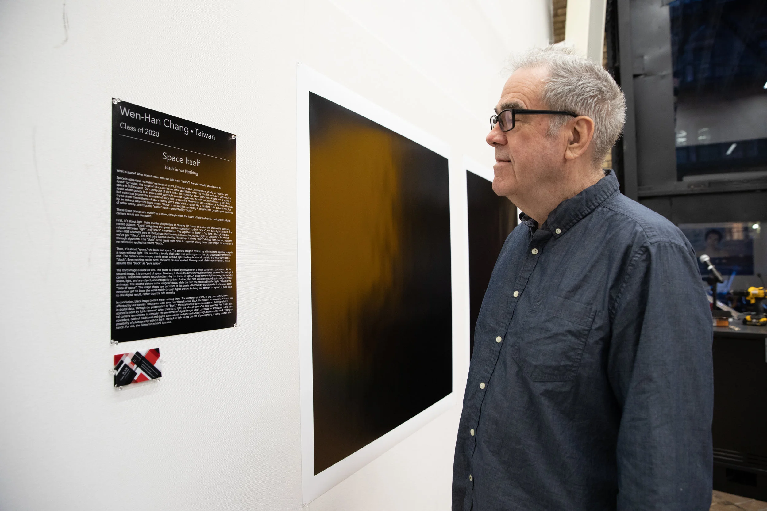 Chris Callis (faculty) observing the works of Wen Han Chang (class of 2020).