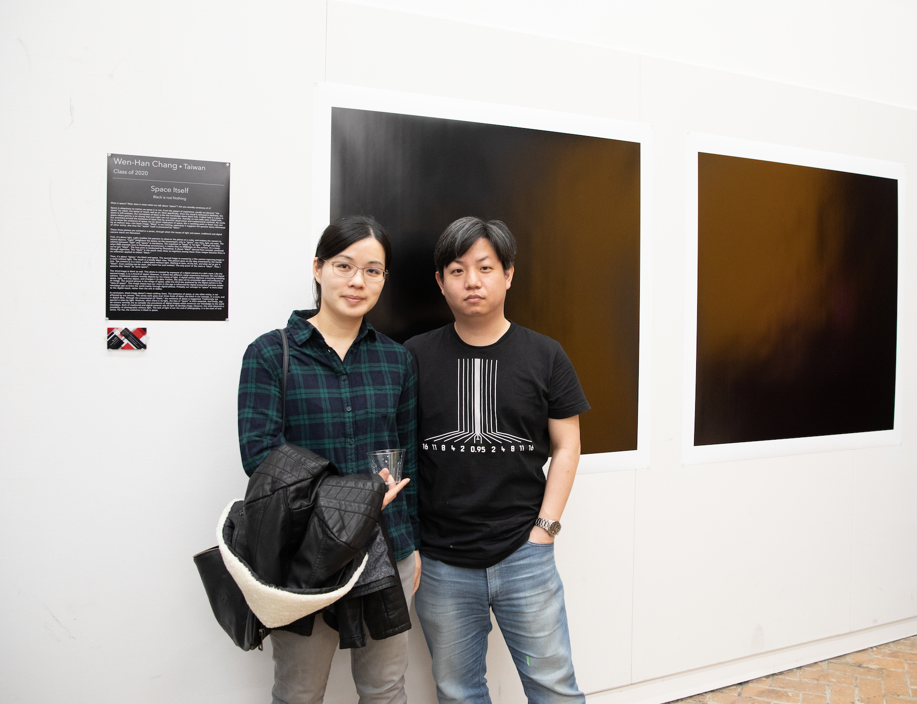 Wen Han Chang (class of 2020) and guest beside his work. 