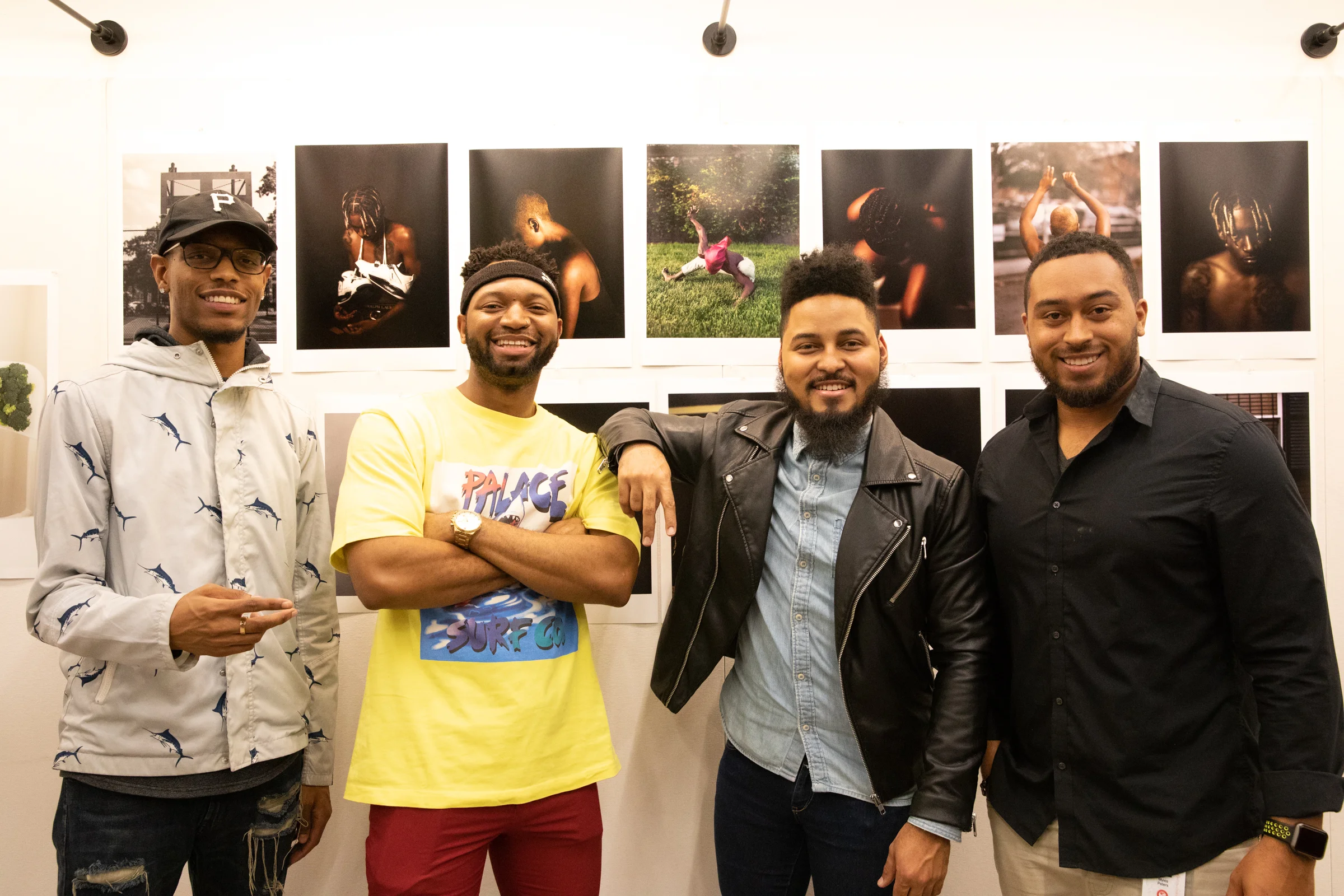 New student Terrance Purdy and friends with his selection of portraiture works.