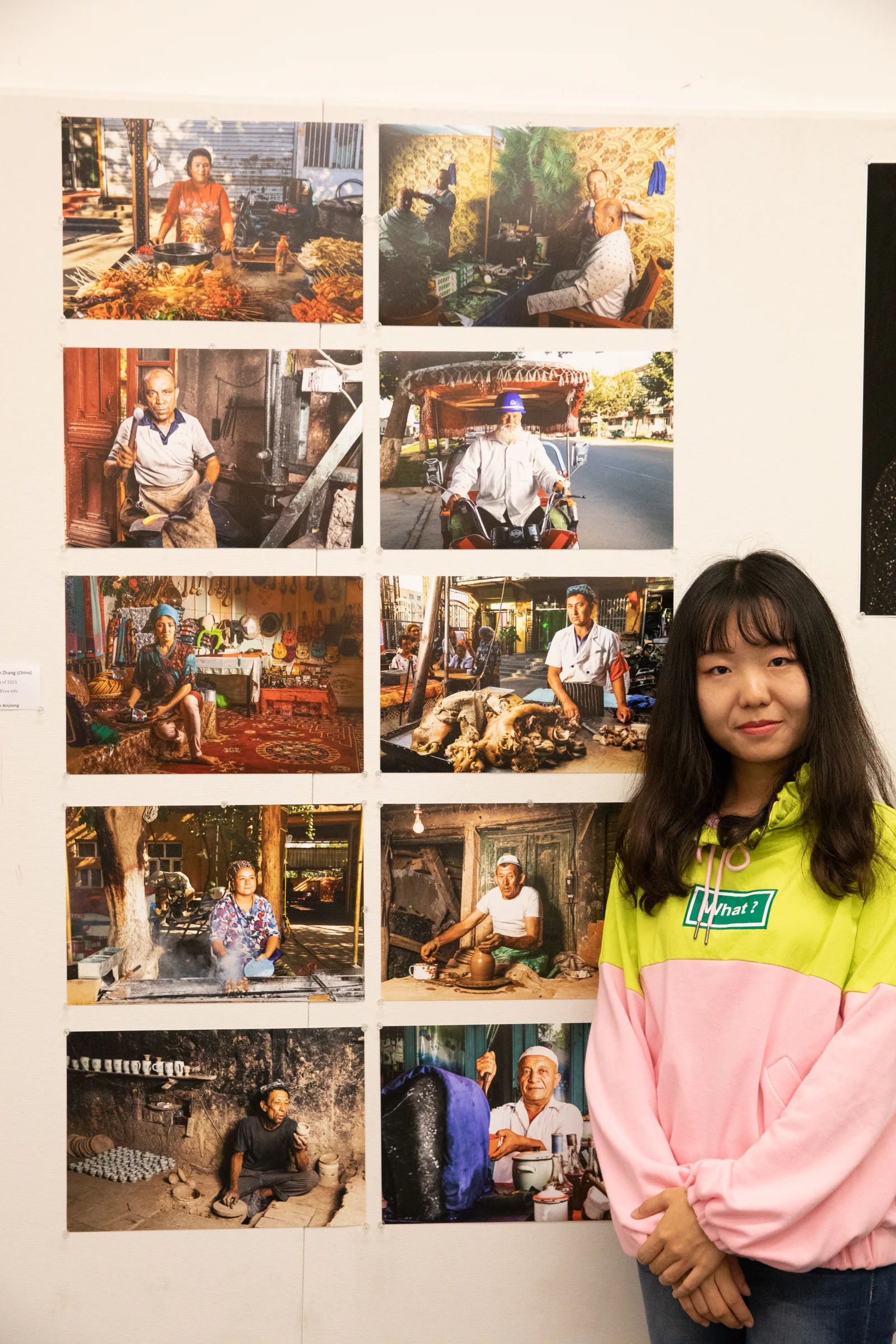 Yeshan Zhang beside her documentary portraiture.