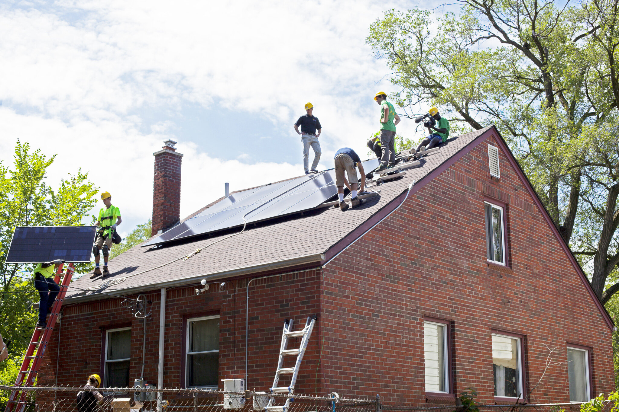  Technicians from our friends at REC Solar near completion on a rooftop solar installation. 
