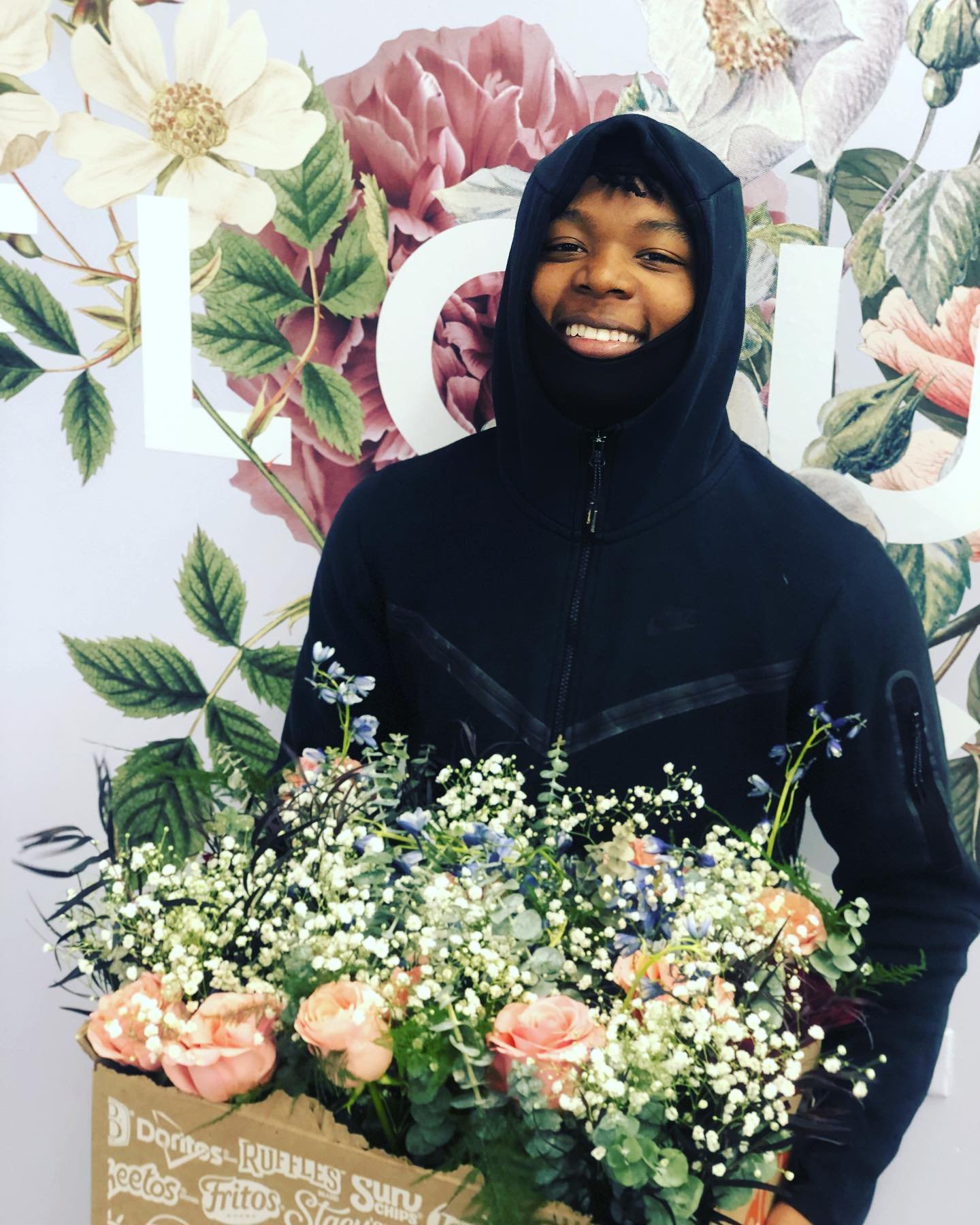 Tashawn_With_Finished_Bouquets.jpg