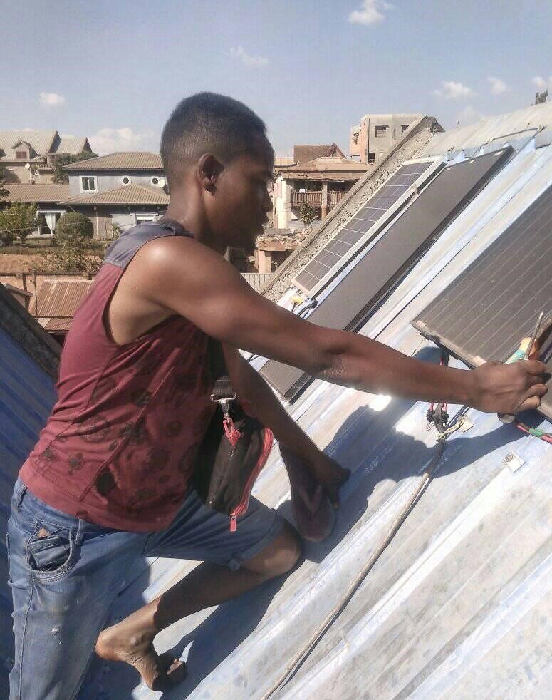 Photo_Tojo_-_Ferdinand_installing_solar_pannel_in_Ambohitseheno.jpg