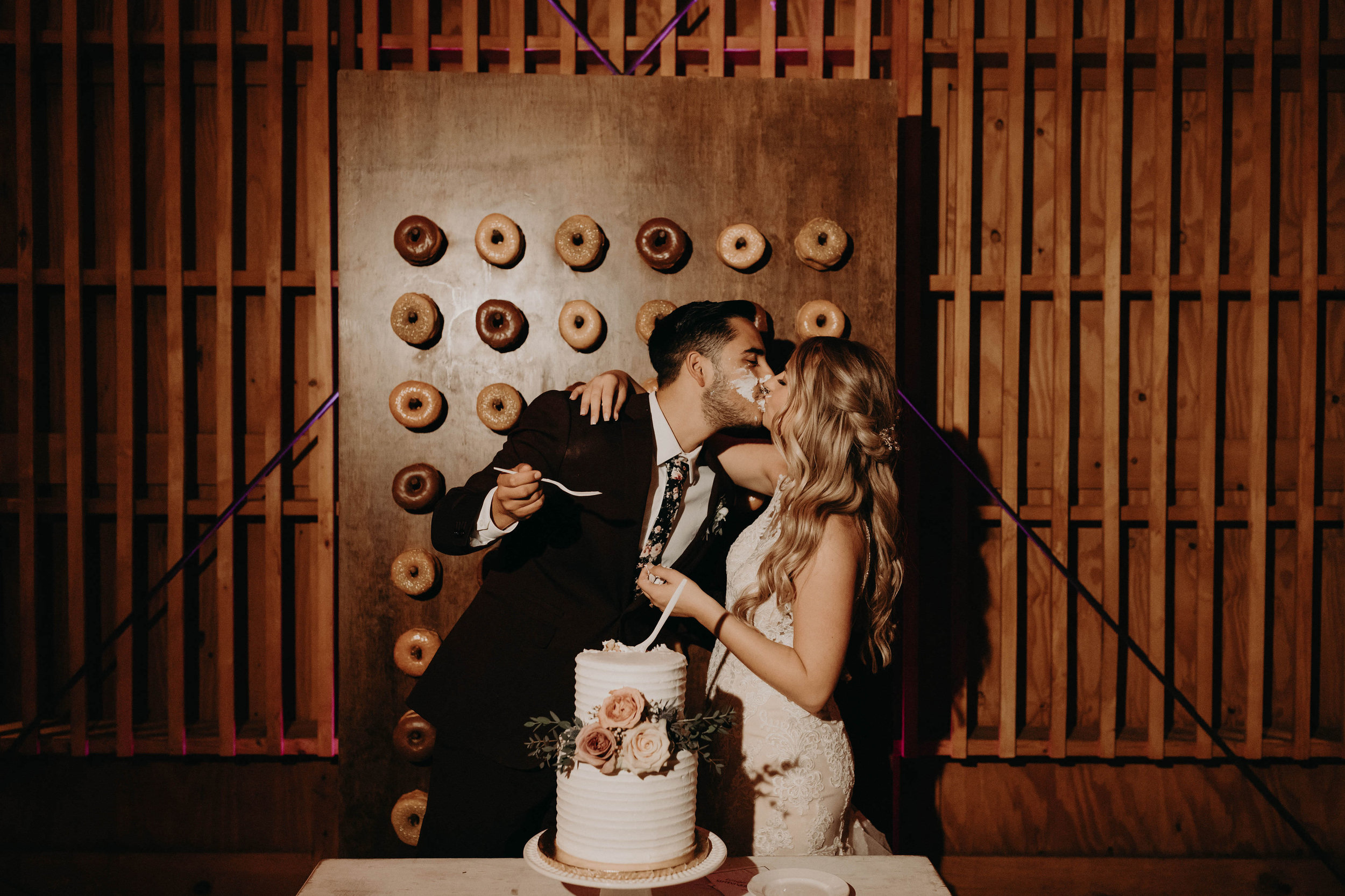 Cake smash with Donut wall at reception space at Paseo Wedding Venue