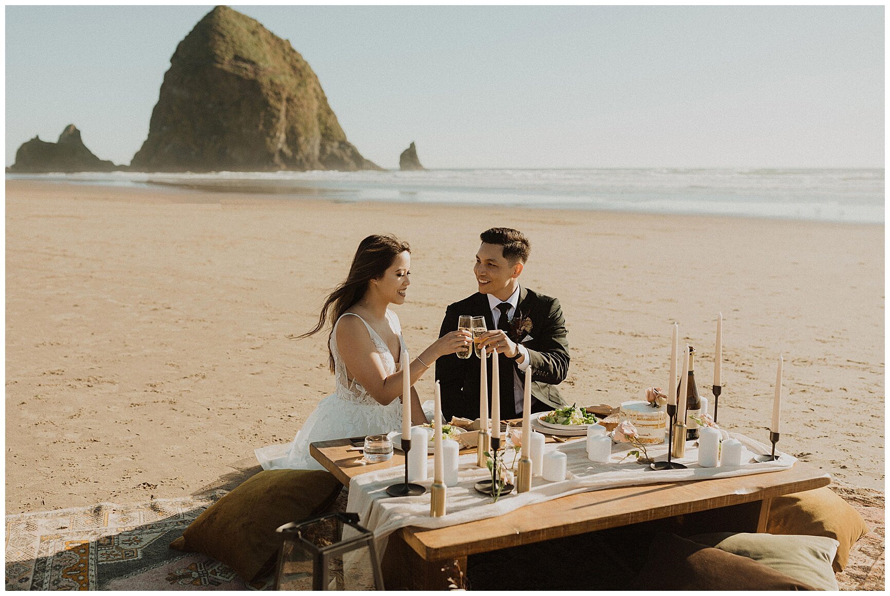 bride and groom having a lunch picnic on Canon beach after their elopement 