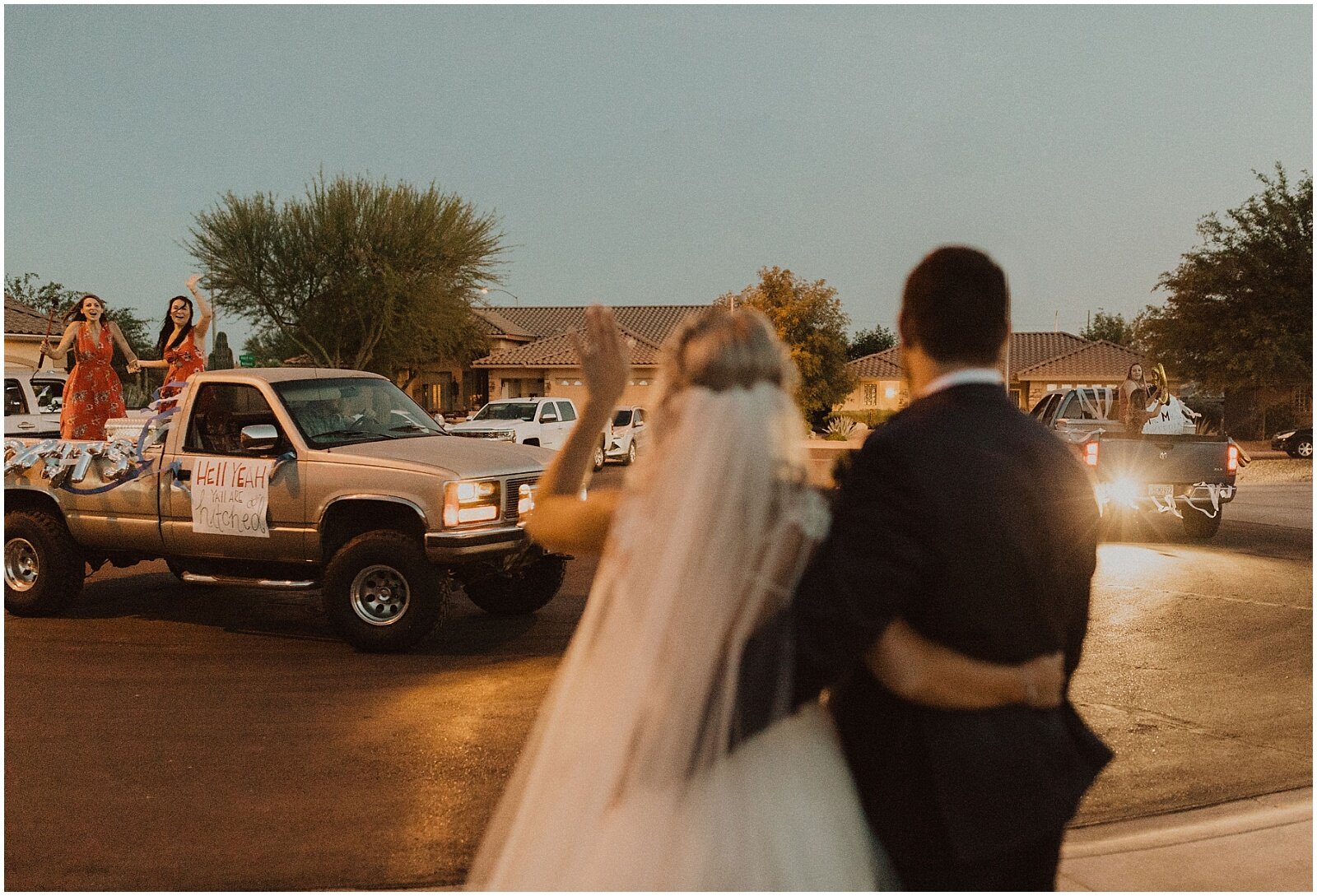 guests greeting the bride and groom at drive through wedding reception