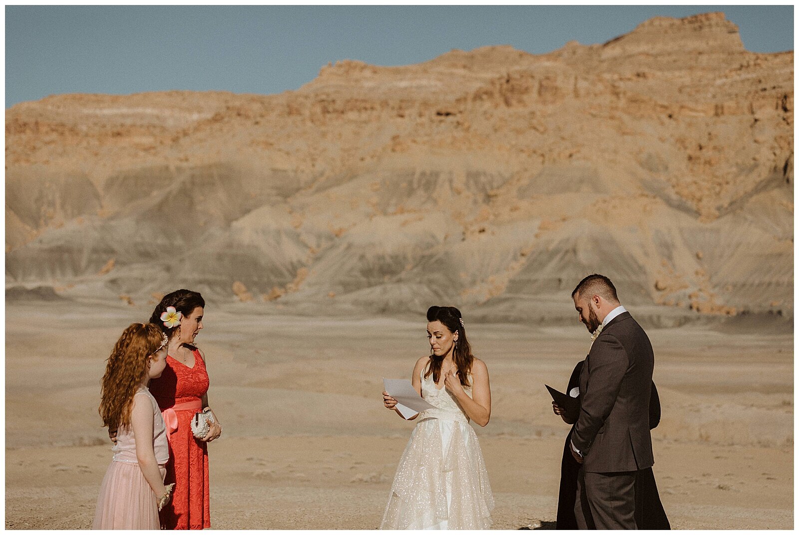 bride and groom exchanging vows during their elopement in page, arizona