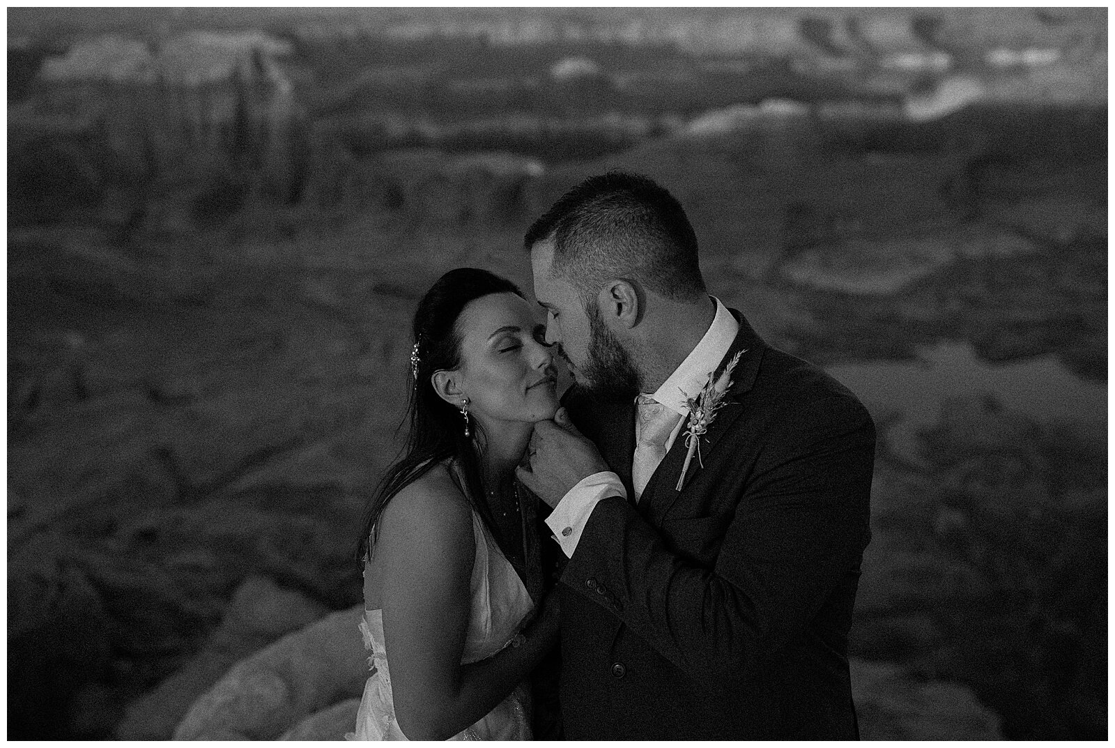 bride and groom posing in the desert for their elopement in page, arizona
