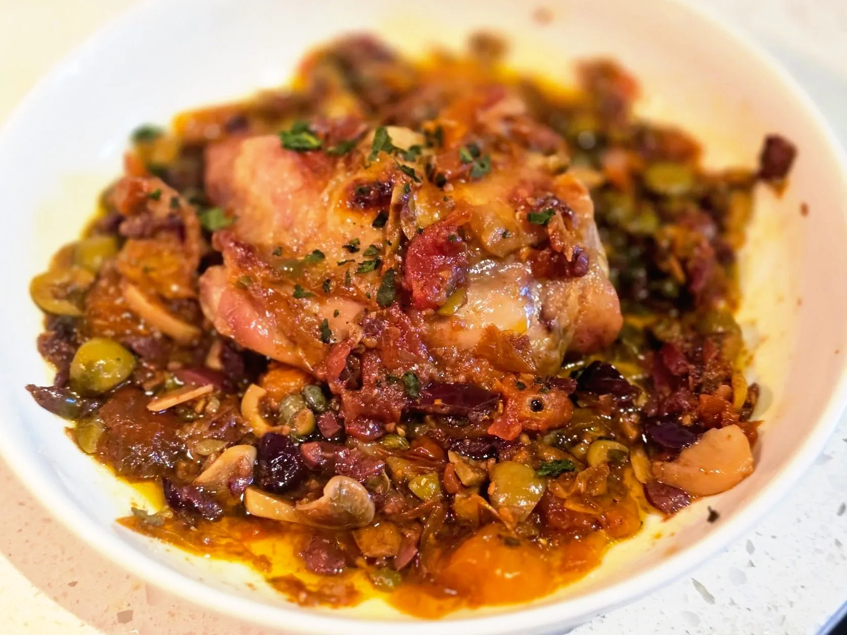 Crispy Chicken Thighs with Tomato Confit Puttanesca