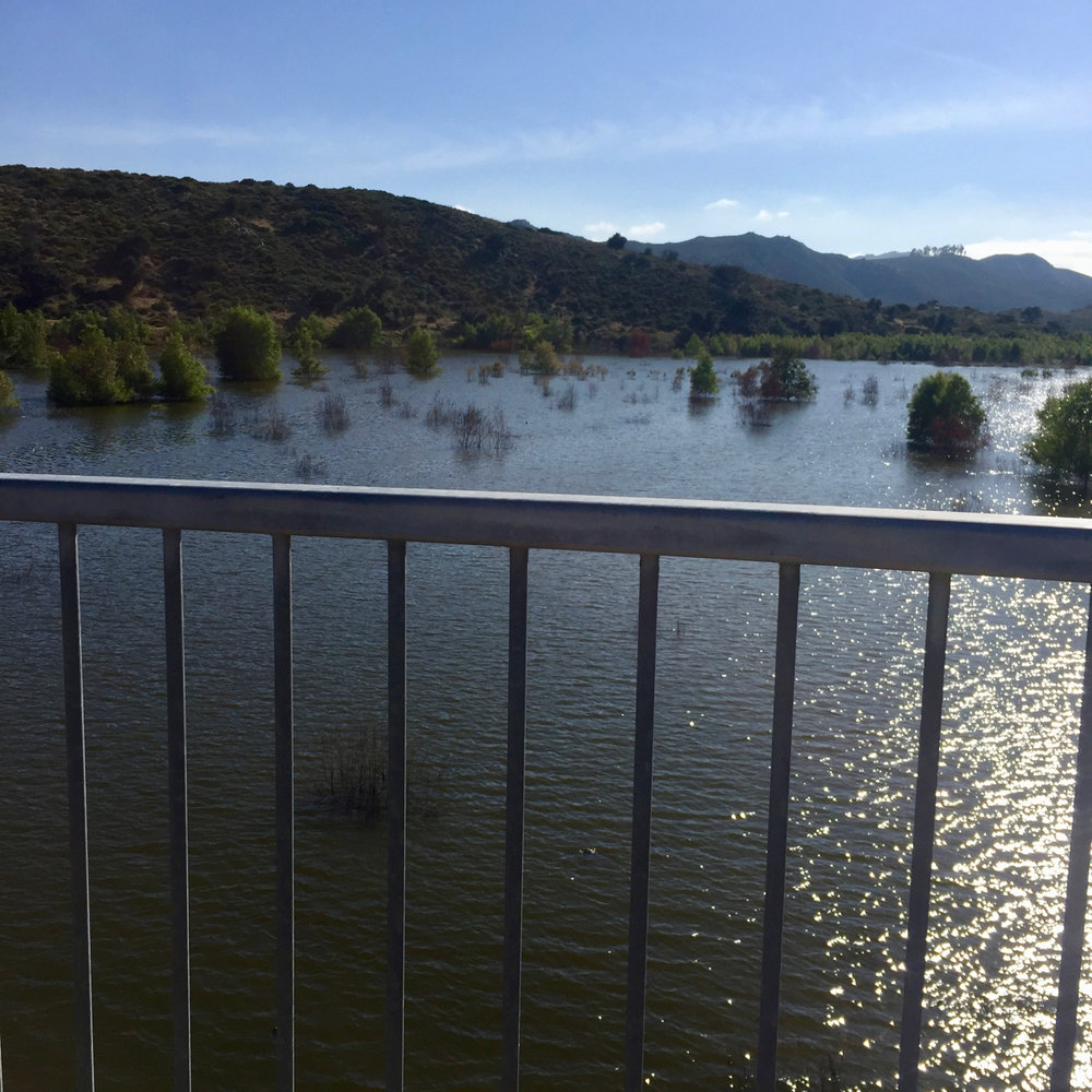 Lake Hodges with water running under the pedestrian/bicycle bridge at Mile 150.