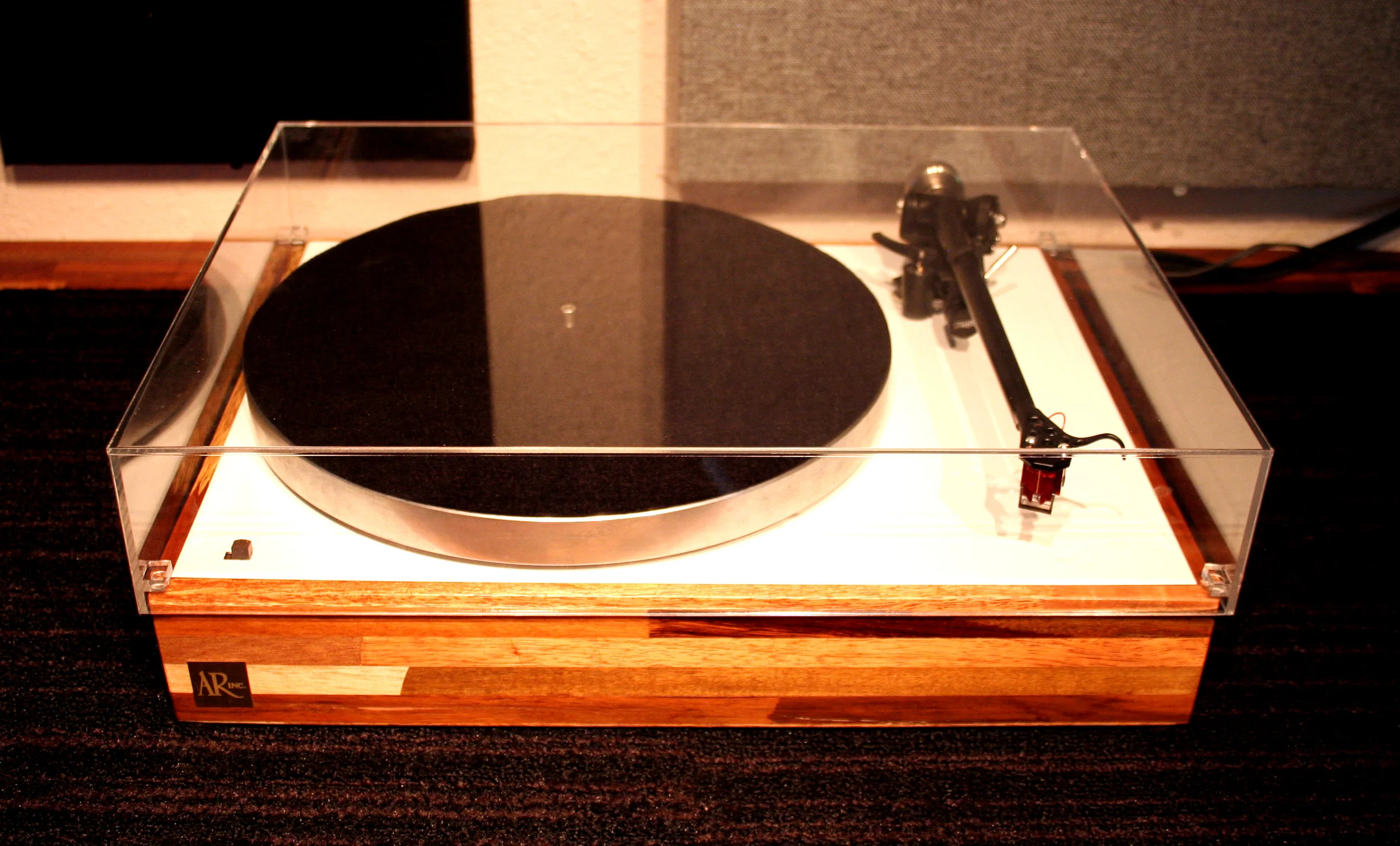 The Delmas Gloss White AR-XA with fixed Rega RB-303 tone-arm, Custom GHA mahogany base, gloss white top, Tungston Heavy counterweight, Denon DL-110 HOMC cartridge. Sold.