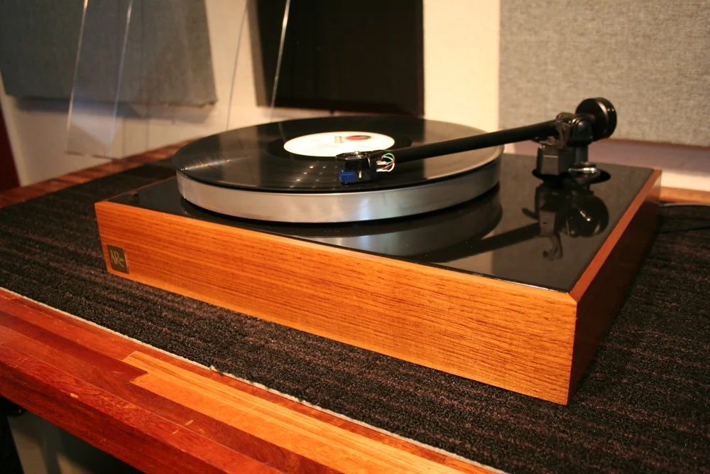 The Suspension 202 Rega 202 tonearm (top modified to allow original T-bar suspension), Sumiko Oyster cartridge, original AR dark walnut base, custom GHA dustcover, original AR XA motor. Sold.