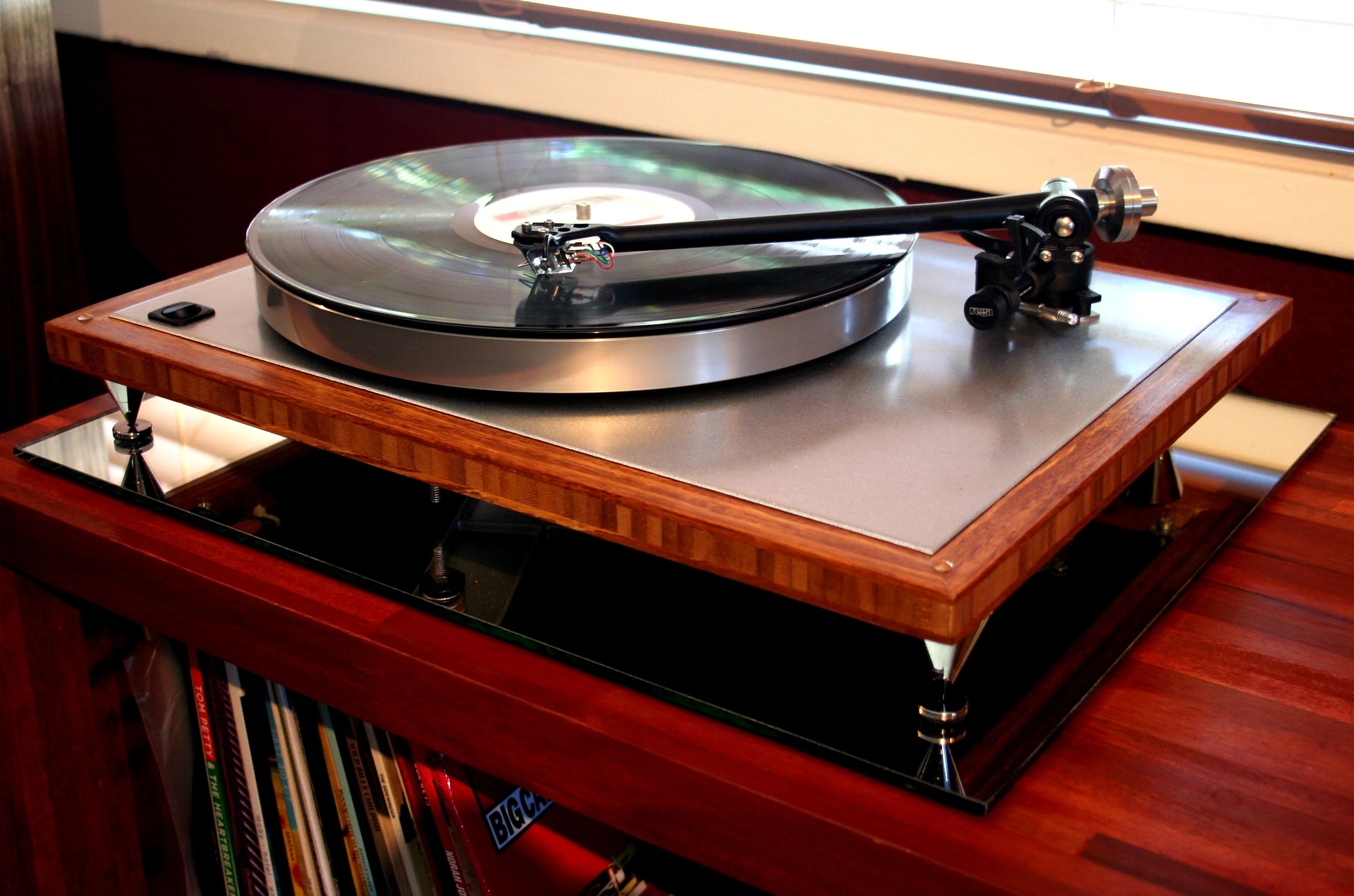 The Naked Bamboo Acoustic Research T-bar, platter, sub-platter, sparkle silver top plate, Rega 303 tonearm, Hurst 300 motor, real bamboo base, rocker on/off switch, 2.5 inch metal spikes, custom dust-cover. $1299 w/out cartridge.
