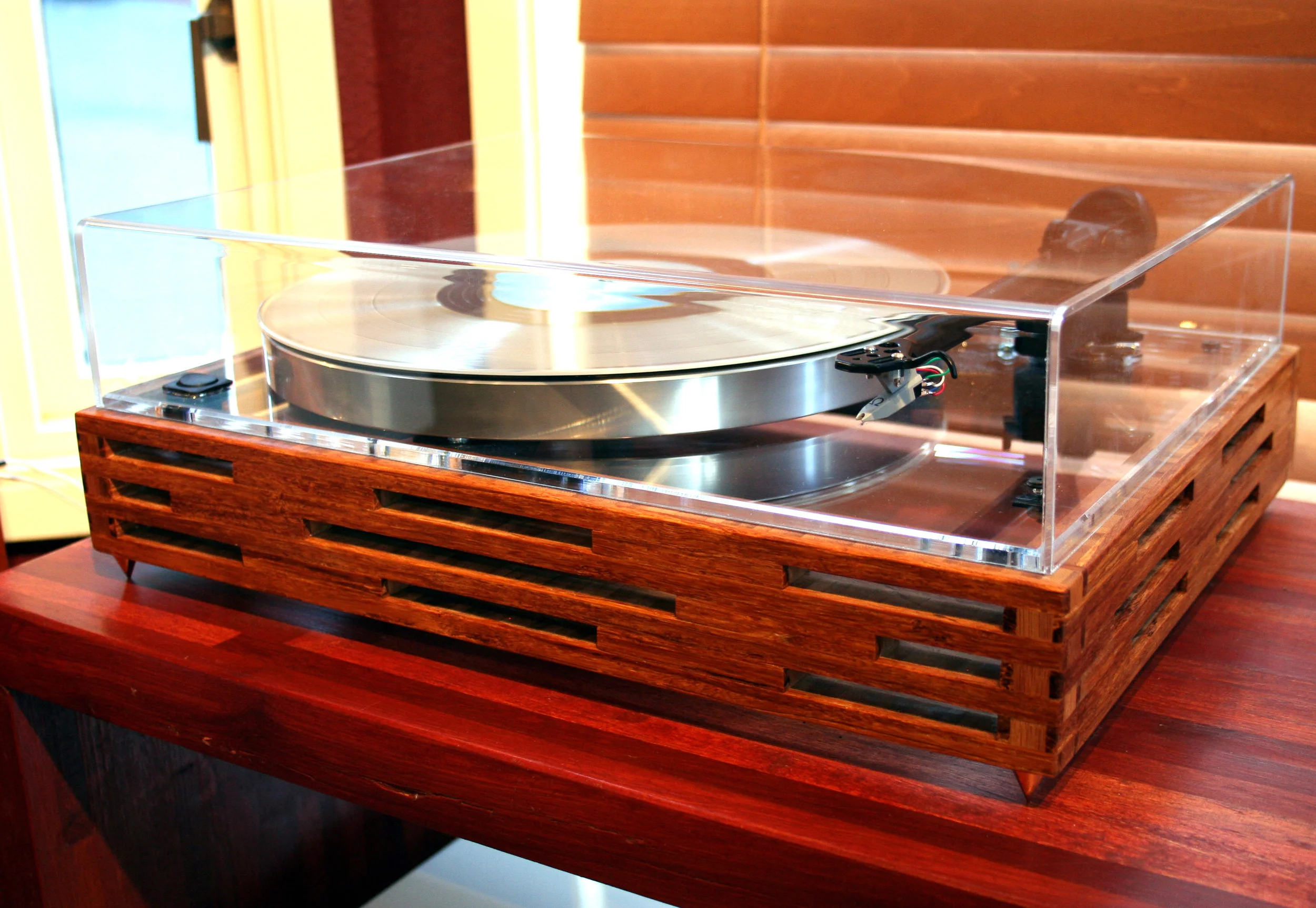 The Sunken Living Room Acoustic Research T-bar, platter, sub-platter, clear plexiglass top plate, Rega 202 tonearm, Hurst 300 motor, Ortofon 10 moving magnet cartridge, real bamboo custom built base, rocker on/off switch, 0.5 inch metal spikes, custom dust-cover. SOLD.