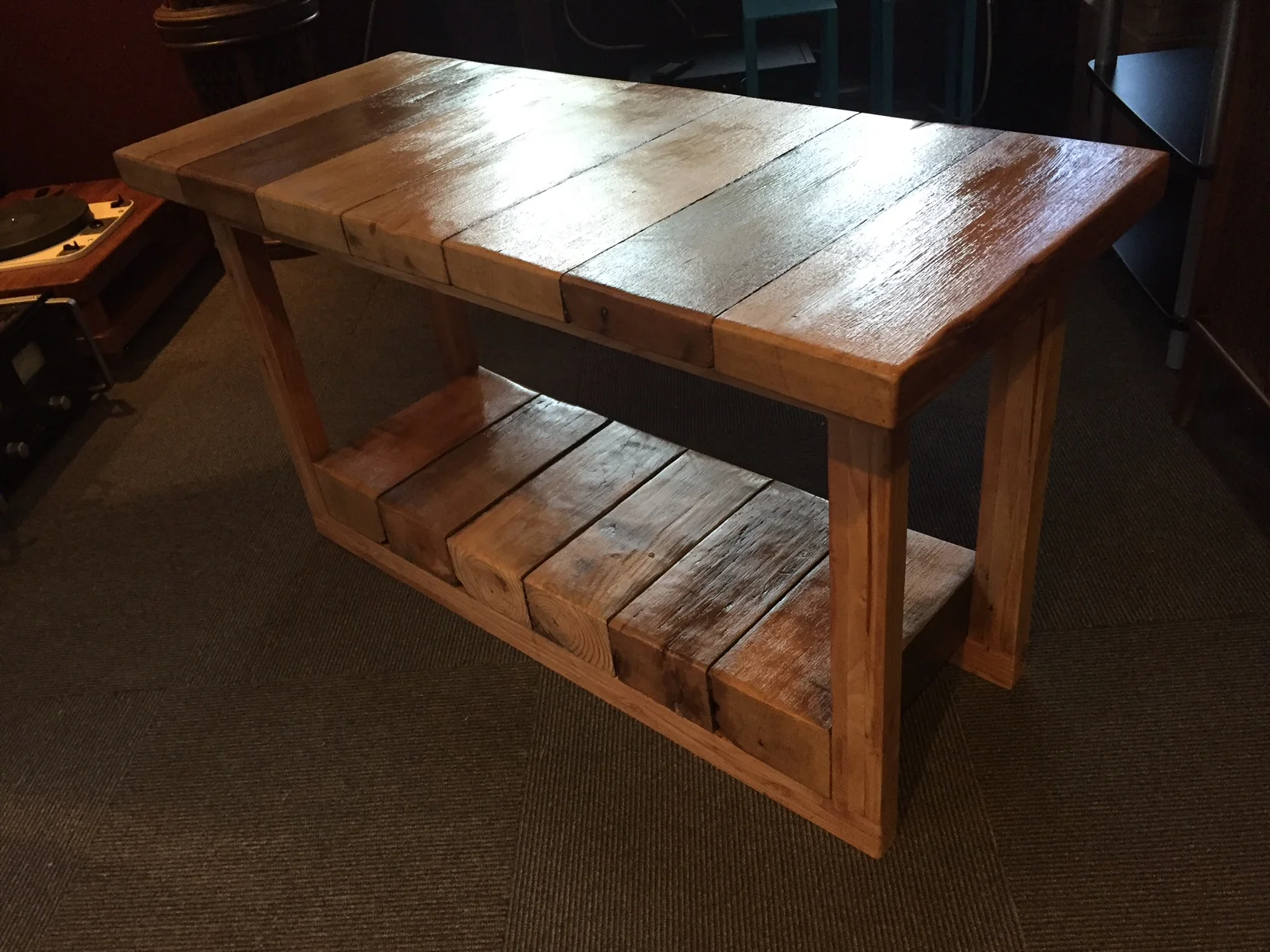 Thick deck wood (reclaimed) used full on the bottom, then ripped length-wise for the pieces on top. The frame pieces are 3 slats glued together. There is even moss that was left on the side that was varnished. SOLD.
