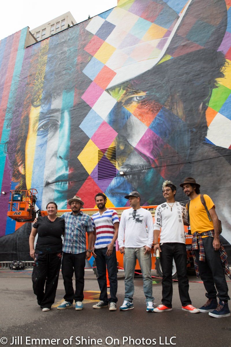 the 6 artists posing for the media.