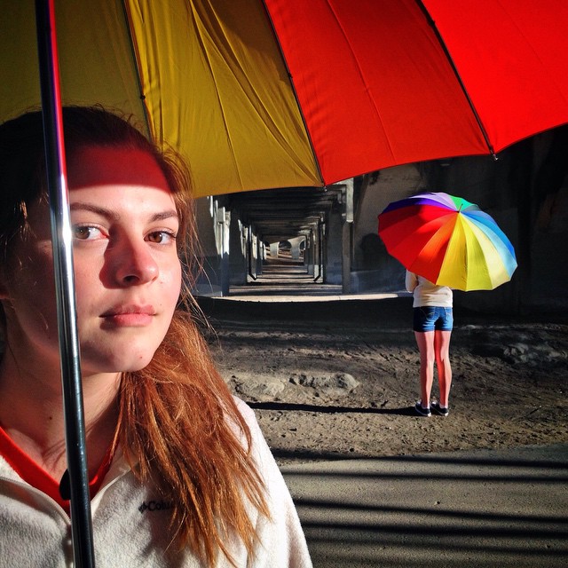 Double Take- a double exposure shot of daughter Eliana holding the umbrella