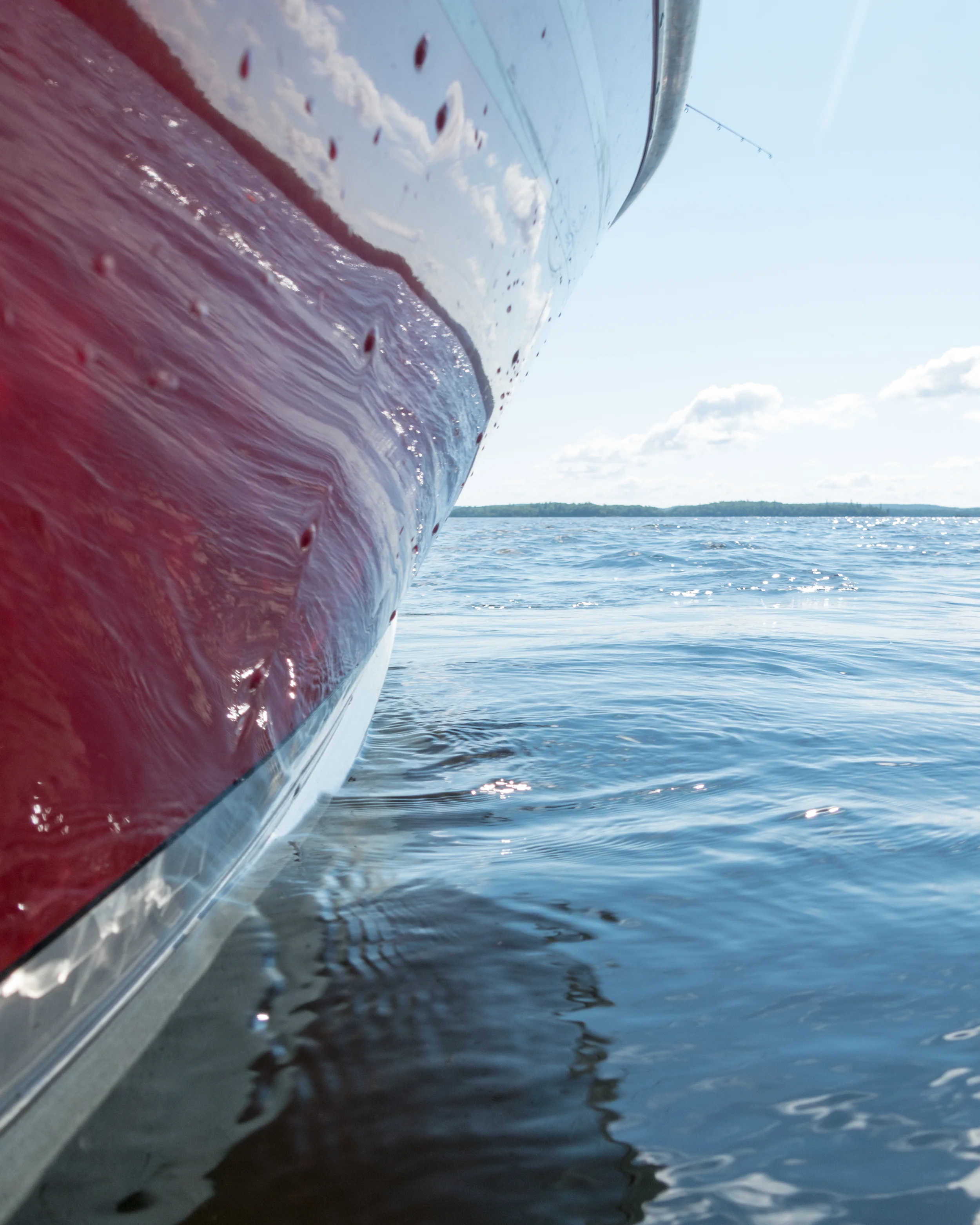 I loved the colors of my dad's bright red boat against the water.